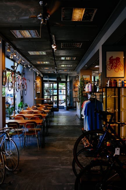 pexels-photo-2817459-2817459 Modern café interior with bicycles displayed, creating a unique shopping and dining experience.