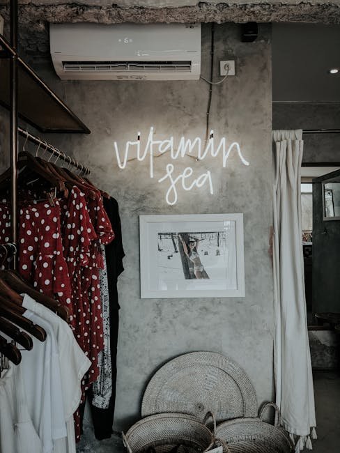pexels-photo-3302537-3302537 Chic Bali boutique featuring fashion items, a neon 'Vitamin Sea' sign, and bohemian decor.