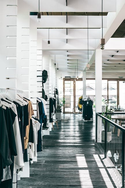 pexels-photo-4940756-4940756 Interior of spacious modern fashion boutique with collection of various clothes hanging on racks in sunlight